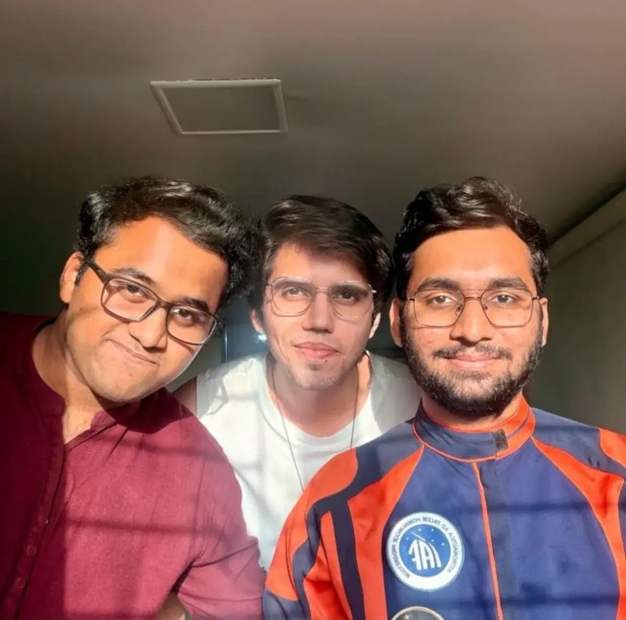 The three founders of IndiaMoonMars, one wearing an IMM suit jacket